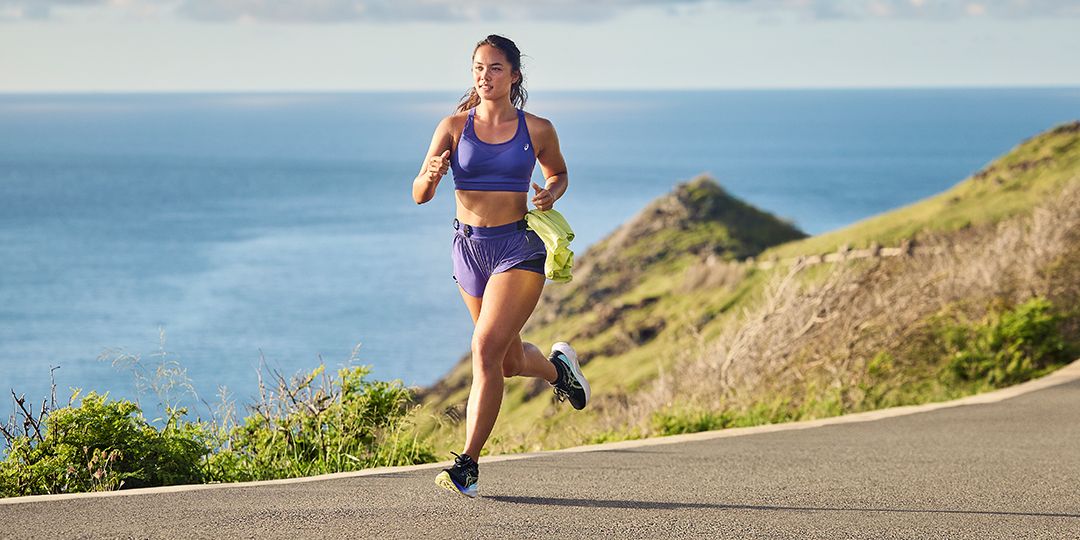 Female runner by ocean